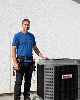 RMI technician servicing an air conditioning system in Orlando, FL